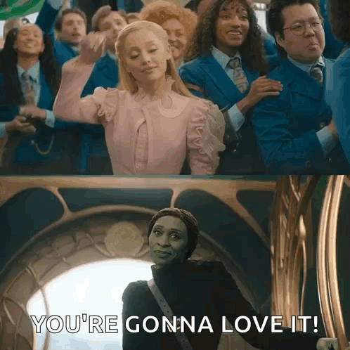 A Woman In A Pink Dress Is Standing In Front Of A Group Of People And Says `` You 'Re Gonna Love It '' . GIF