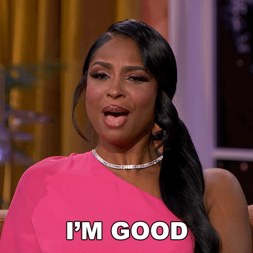 A Woman In A Pink Dress Says I 'M Good With Her Tongue Out GIF