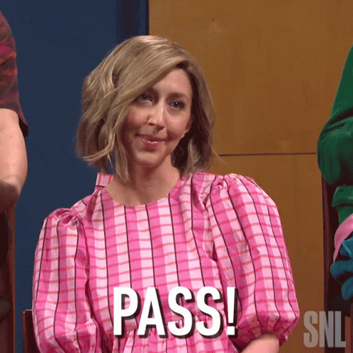 A Woman In A Pink Dress Says Pass On Her Shirt GIF