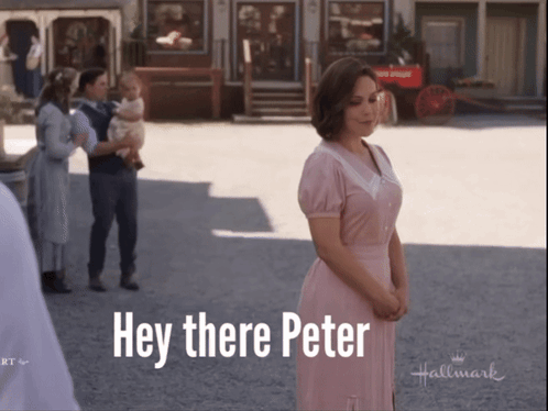 A Woman In A Pink Dress Stands In Front Of A Sign That Says " Hey There Peter " GIF