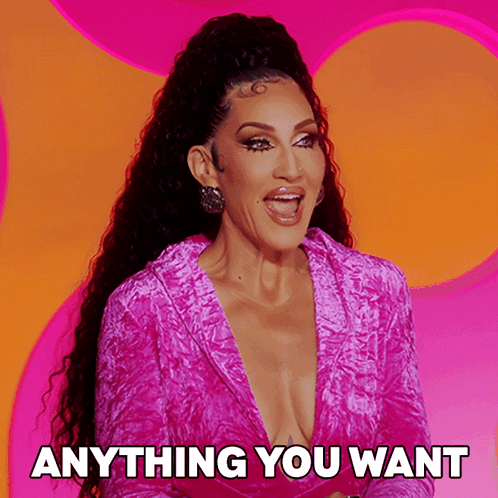 A Woman In A Pink Dress With The Words Anything You Want Below Her GIF