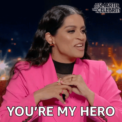 A Woman In A Pink Jacket Is Saying You 'Re My Hero GIF