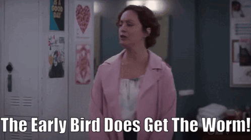 A Woman In A Pink Jacket Says " The Early Bird Does Get The Worm! " GIF
