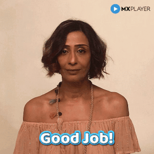 A Woman In A Pink Off The Shoulder Top Says " Good Job " GIF