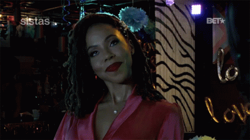 A Woman In A Pink Robe Says I Did In Front Of A Zebra Print Wall GIF