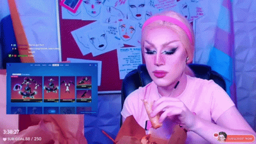 A Woman In A Pink Shirt Is Eating A Chicken Nugget While Watching A Video GIF