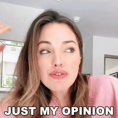 A Woman In A Pink Shirt Is Making A Face And Says Just My Opinion GIF