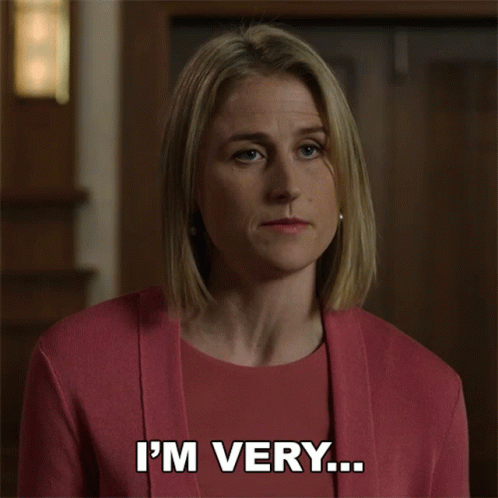 A Woman In A Pink Shirt Is Making A Funny Face And Says Embarrassed To Admit This GIF