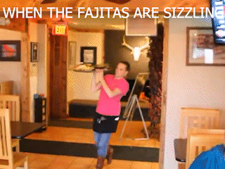 A Woman In A Pink Shirt Is Playing A Flute In A Restaurant With The Words " When The Fajitas Are Sizzling " GIF