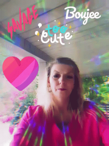 A Woman In A Pink Shirt Is Surrounded By A Heart And The Words " Savage Too Cute " GIF