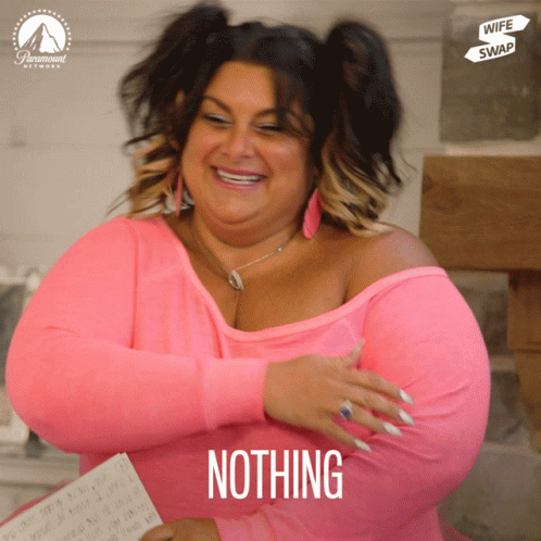 A Woman In A Pink Shirt With The Word Nothing On Her Chest GIF