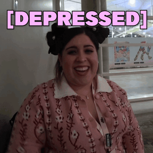 A Woman In A Pink Sweater Is Smiling With The Words [ Depressed ] Behind Her GIF