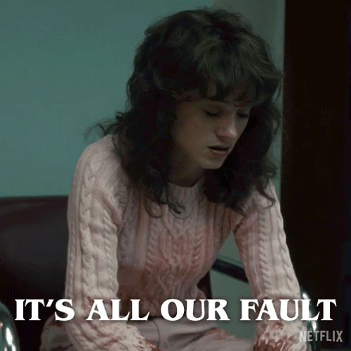 A Woman In A Pink Sweater Says It 'S All Our Fault On The Screen GIF