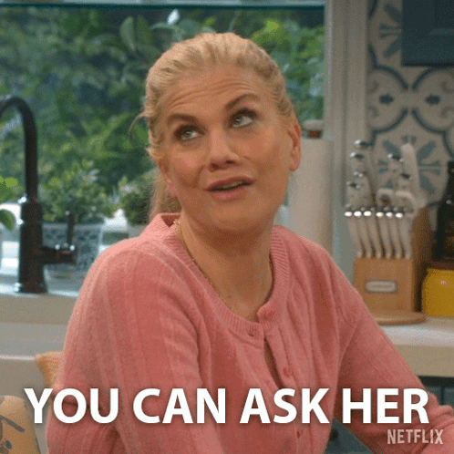 a woman in a pink sweater says you can ask her netflix