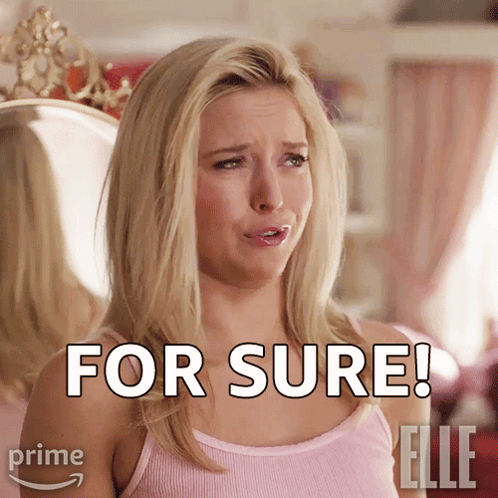A Woman In A Pink Tank Top Says For Sure In Front Of A Mirror GIF