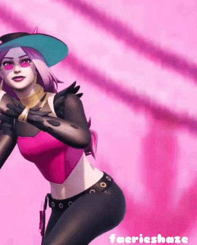 A Woman In A Pink Top And Black Pants Is Standing In Front Of A Pink Background . GIF