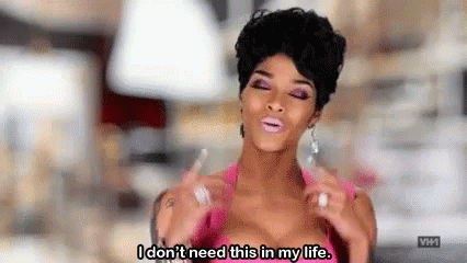 A Woman In A Pink Top Is Saying `` I Don 'T Need This In My Life '' . GIF
