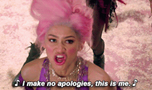 A Woman In A Pink Wig Is Saying " I Make No Apologies This Is Me " GIF