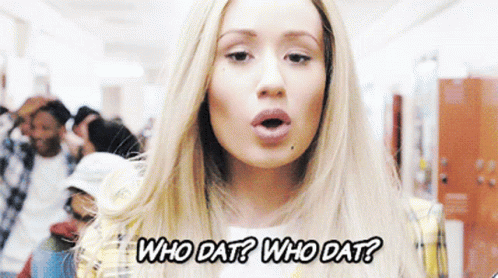 A Woman In A Plaid Jacket Is Asking Who Dat GIF