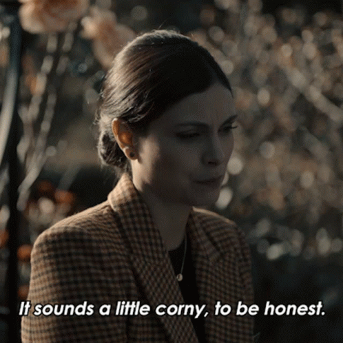 A Woman In A Plaid Jacket Is Saying It Sounds A Little Corny To Be Honest GIF
