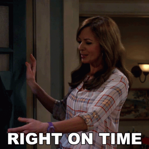 a woman in a plaid shirt is standing in front of a door with the words right on time behind her