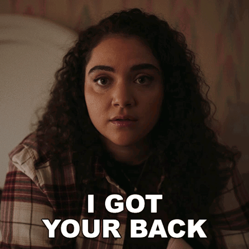 A Woman In A Plaid Shirt Says " I Got Your Back " In White Letters GIF