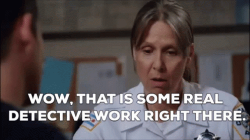 A Woman In A Police Uniform Is Talking To A Man In A Police Station And Saying Wow That Is Some Real Detective Work Righ GIF