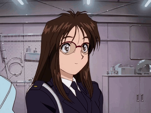A Woman In A Police Uniform With Glasses Stands In Front Of A Shelf That Says Bosch GIF
