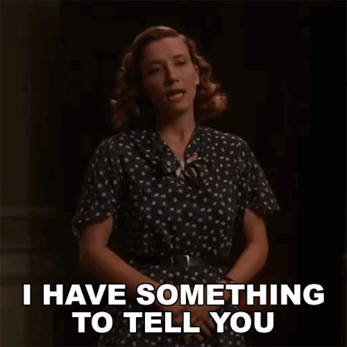 A Woman In A Polka Dot Dress Says I Have Something To Tell You . GIF