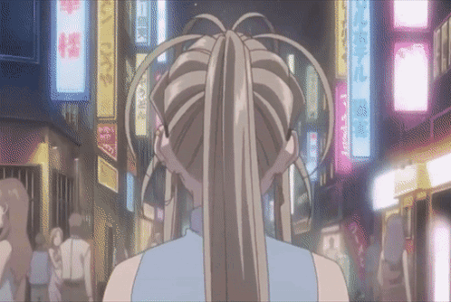 A Woman In A Ponytail Is Walking Down A Street With A Sign That Says ' A ' On It GIF