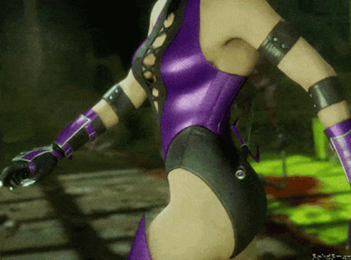 A Woman In A Purple Bodysuit And Purple Gloves Stands In A Dark Room GIF