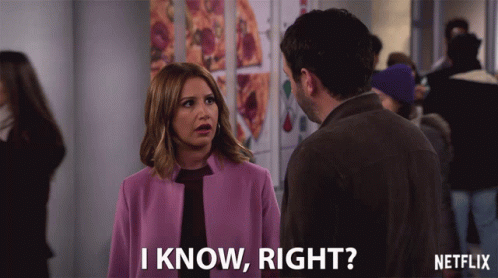 A Woman In A Purple Coat Is Talking To A Man And Says " I Know Right " GIF