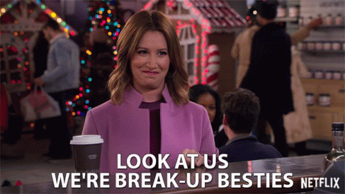 A Woman In A Purple Coat Says Look At Us We 'Re Break-Up Besties GIF