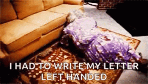 A Woman In A Purple Dress Is Laying On The Floor Next To A Couch And A Rug . GIF