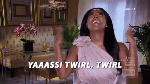 A Woman In A Purple Dress Is Saying Yaaass ! Twirl , Twirl GIF