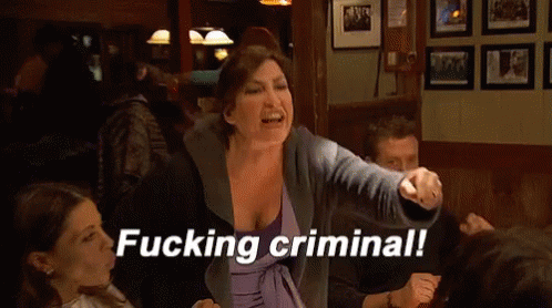 A Woman In A Purple Dress Is Yelling At A Group Of People And The Words Fucking Criminal Appear On The Screen GIF