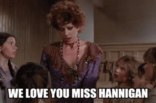 A Woman In A Purple Dress Says We Love You Miss Hannigan To A Group Of Girls GIF