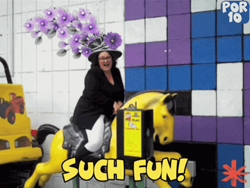 A Woman In A Purple Hat Is Riding A Yellow Horse With The Words Such Fun Below Her GIF