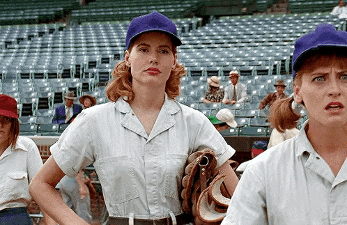 Woman In Purple Hat Next To Man With Baseball Glove GIF