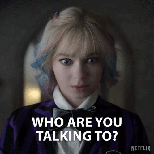A Woman In A Purple Jacket And Bow Tie Is Asking Who Are You Talking To GIF