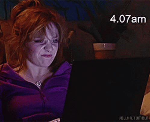 A Woman In A Purple Jacket Is Using A Laptop With The Time 4.08Am GIF