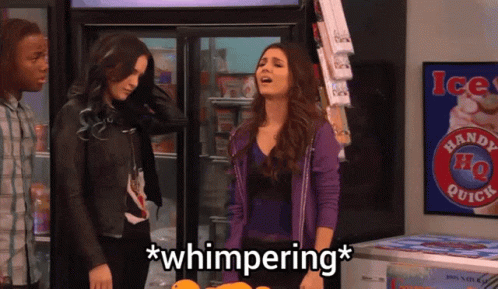 A Woman In A Purple Jacket Stands In Front Of A Handy Ho Quick Sign GIF