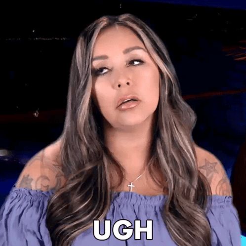 A Woman In A Purple Off The Shoulder Top Says Ugh On Her Face GIF