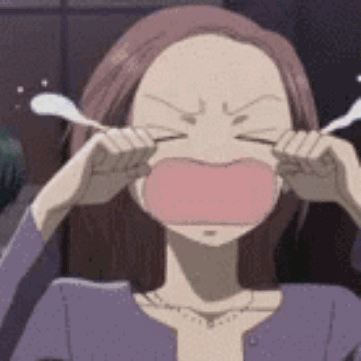 a woman in a purple shirt is crying with her eyes closed .