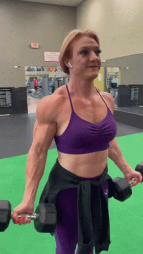 Woman In Purple Sports Bra Lifting Dumbbells GIF