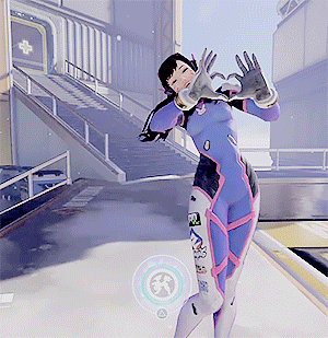 A Woman In A Purple Suit Is Dancing In Front Of A Building With A White Cross On It GIF