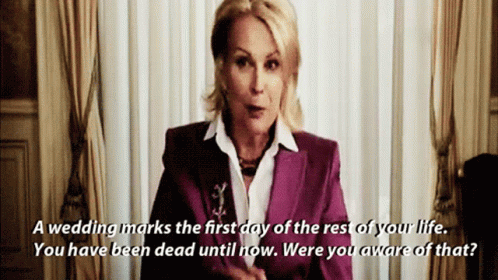 A Woman In A Purple Suit Says " A Wedding Marks The First Day Of The Rest Of Your Life GIF