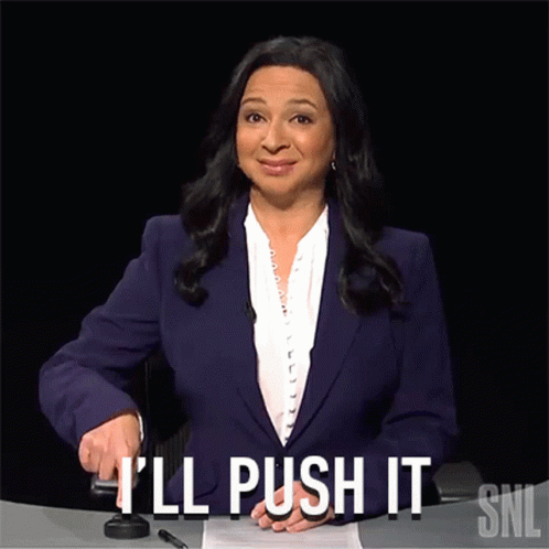 A Woman In A Purple Suit Says I 'Ll Push It Snl GIF