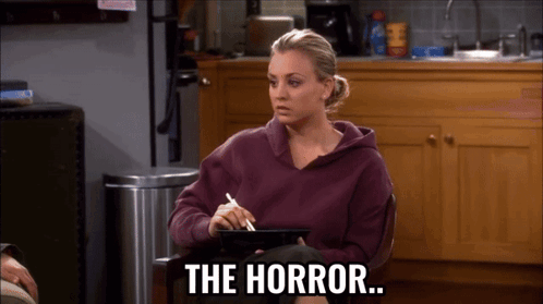 Woman In Purple Sweatshirt Holding Tablet Says The Horror GIF