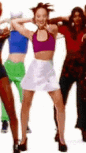 Woman In Purple Top And White Skirt Dancing With Group GIF